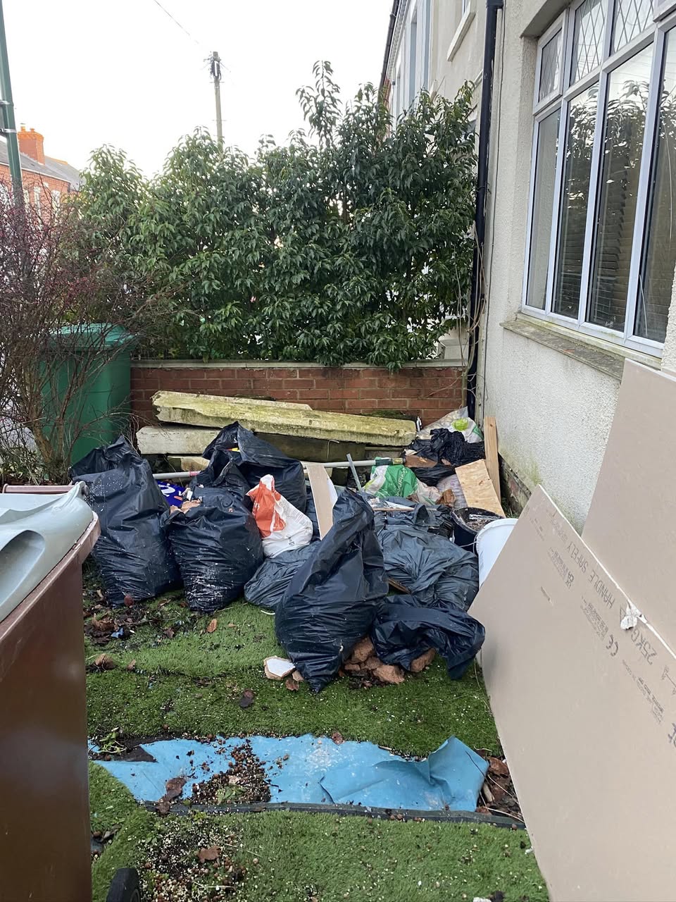 Waste bags in side alley