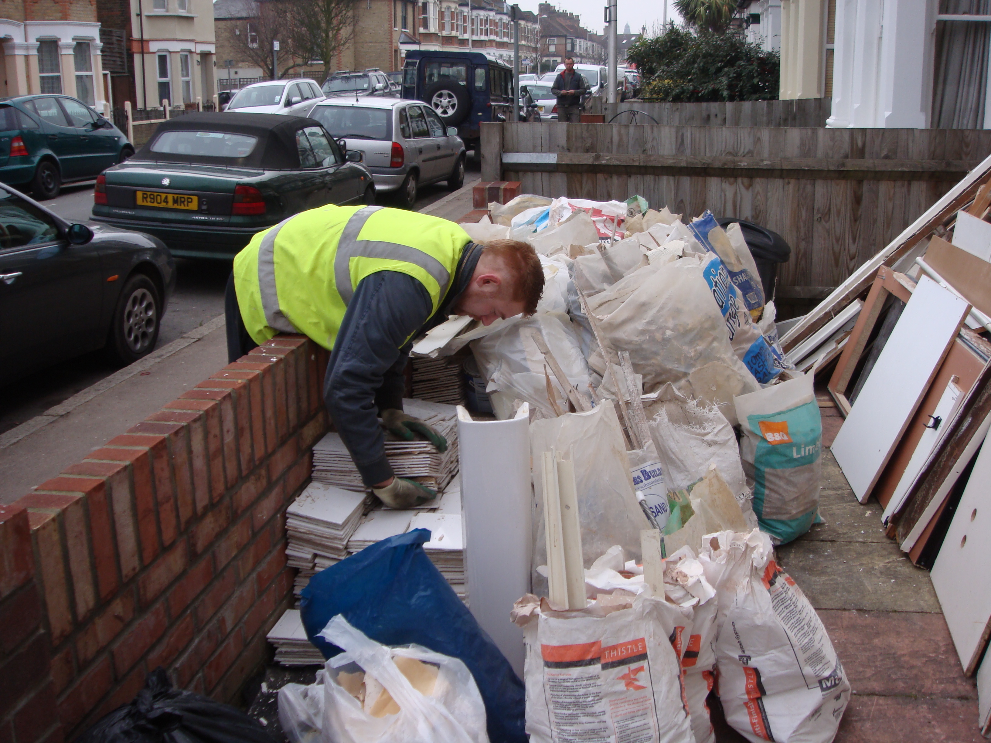 Worker sorting construction waste