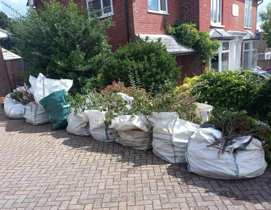 Garden waste removal bags on driveway